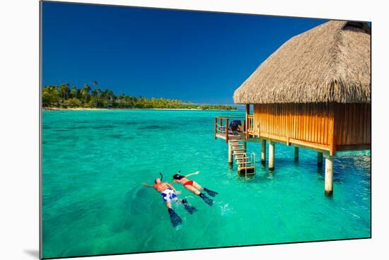 Young Couple Snorkeling from Hut over Blue Tropical Lagoon-Martin Valigursky-Mounted Photographic Print