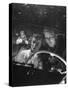 Young Couple Snuggling in Convertible as They Intently Watch Movie at Drive-in Movie Theater-J^ R^ Eyerman-Stretched Canvas