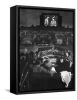 Young Couple Snuggling in Convertible as They Watch Large Screen Action at a Drive-In Movie Theater-J^ R^ Eyerman-Framed Stretched Canvas