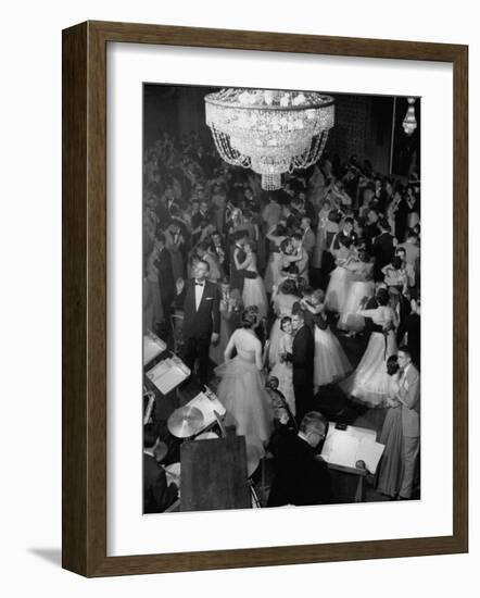 Young Couples at Formal Dance Dreamily Swaying on Crowded Floor of Dim, Chandelier-Lit Ballroom-Nina Leen-Framed Photographic Print