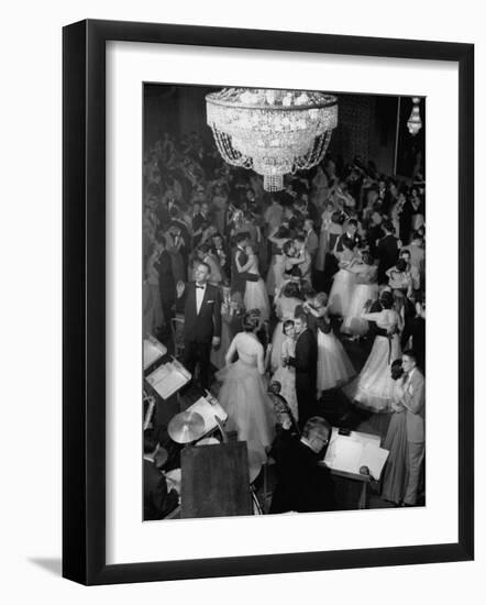 Young Couples at Formal Dance Dreamily Swaying on Crowded Floor of Dim, Chandelier-Lit Ballroom-Nina Leen-Framed Photographic Print