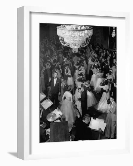 Young Couples at Formal Dance Dreamily Swaying on Crowded Floor of Dim, Chandelier-Lit Ballroom-Nina Leen-Framed Photographic Print