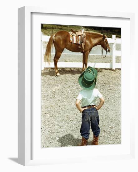 Young Cowboy Looking at Horse-William P. Gottlieb-Framed Photographic Print