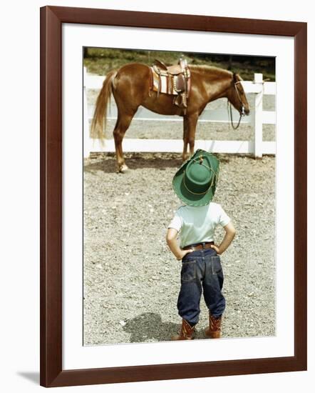 Young Cowboy Looking at Horse-William P. Gottlieb-Framed Photographic Print