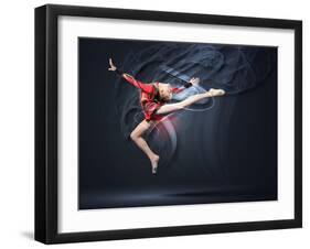 Young Cute Woman In Gymnast Suit Show Athletic Skill On Black Background-Sergey Nivens-Framed Art Print