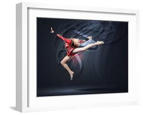 Young Cute Woman In Gymnast Suit Show Athletic Skill On Black Background-Sergey Nivens-Framed Art Print