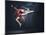 Young Cute Woman In Gymnast Suit Show Athletic Skill On Black Background-Sergey Nivens-Mounted Art Print