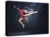 Young Cute Woman In Gymnast Suit Show Athletic Skill On Black Background-Sergey Nivens-Stretched Canvas