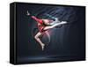 Young Cute Woman In Gymnast Suit Show Athletic Skill On Black Background-Sergey Nivens-Framed Stretched Canvas