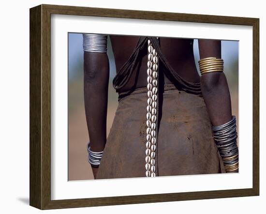 Young Dassanech Girl Wears a Leather Skirt, Metal Bracelets, Amulets and Bead Necklaces, Ethiopia-John Warburton-lee-Framed Photographic Print