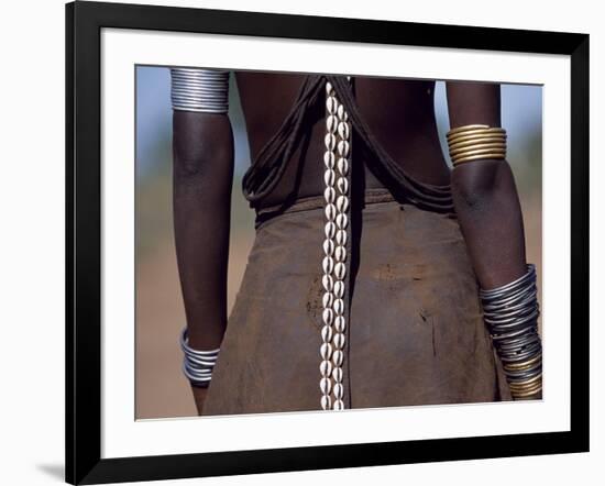 Young Dassanech Girl Wears a Leather Skirt, Metal Bracelets, Amulets and Bead Necklaces, Ethiopia-John Warburton-lee-Framed Photographic Print