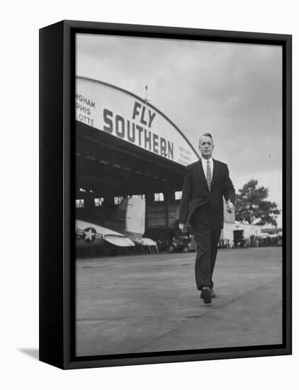 Young Exec Wearing a Brooks Brothers Type of Suit Walking around an Airport-null-Framed Stretched Canvas