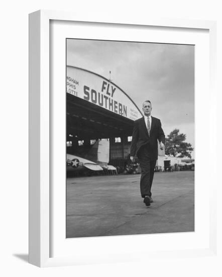 Young Exec Wearing a Brooks Brothers Type of Suit Walking around an Airport-null-Framed Photographic Print