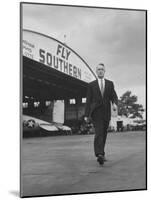 Young Exec Wearing a Brooks Brothers Type of Suit Walking around an Airport-null-Mounted Photographic Print