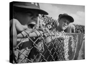 Young Fans Standing at Fence Which Borders Field at World Series Game, Braves vs. Yankees-Grey Villet-Stretched Canvas