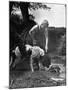 Young Farm Boy Watching His Dog Sniff a Large Turtle at the Pond-Myron Davis-Mounted Photographic Print
