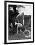 Young Farm Boy Watching His Dog Sniff a Large Turtle at the Pond-Myron Davis-Framed Photographic Print