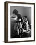 Young Father Helping His Wife Get Dressed as Their Sons Look On-Mark Kauffman-Framed Photographic Print