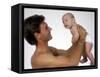 Young Father Holding Newborn Child-Bill Bachmann-Framed Stretched Canvas