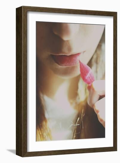 Young Female Holding a Red Leaf to Her Lips-Carolina Hernandez-Framed Photographic Print