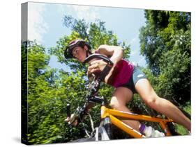 Young Female Recreational Mountain Biker Riding in the Forest-null-Stretched Canvas