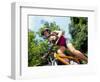 Young Female Recreational Mountain Biker Riding in the Forest-null-Framed Photographic Print