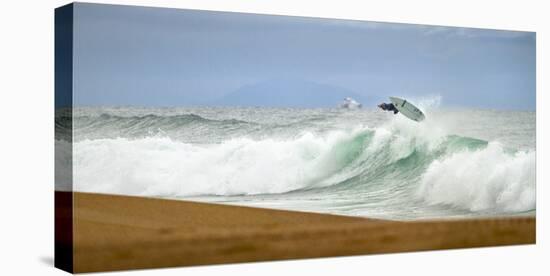 Young French Surfer with a Radical Air in Plage Les Casernes, France-Axel Brunst-Stretched Canvas