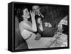 Young Girl Drinking the Remains of the Other Glasses on the Table after Finishing Her Own Champagne-null-Framed Stretched Canvas