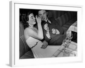 Young Girl Drinking the Remains of the Other Glasses on the Table after Finishing Her Own Champagne-null-Framed Photographic Print