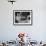 Young Girl Drinking the Remains of the Other Glasses on the Table after Finishing Her Own Champagne-null-Framed Photographic Print displayed on a wall