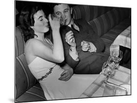 Young Girl Drinking the Remains of the Other Glasses on the Table after Finishing Her Own Champagne-null-Mounted Photographic Print