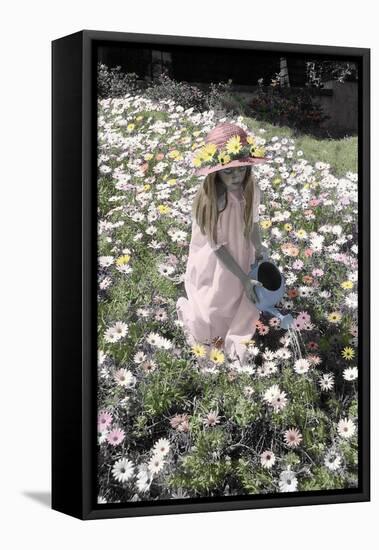Young Girl in a Field of Flowers Watering Them-Nora Hernandez-Framed Stretched Canvas