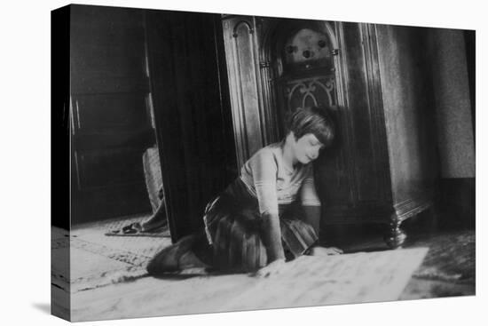 Young Girl Listens to the Radio While Reading Paper, Ca. 1930-null-Stretched Canvas