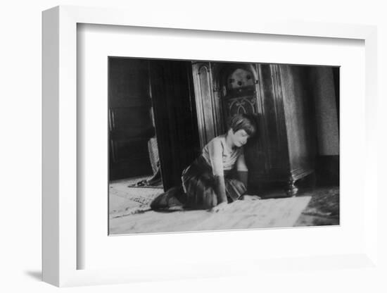 Young Girl Listens to the Radio While Reading Paper, Ca. 1930-null-Framed Photographic Print