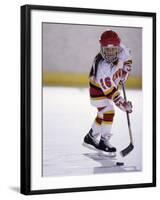 Young Girl Playing Ice Hockey-null-Framed Photographic Print