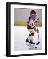 Young Girl Playing Ice Hockey-null-Framed Photographic Print