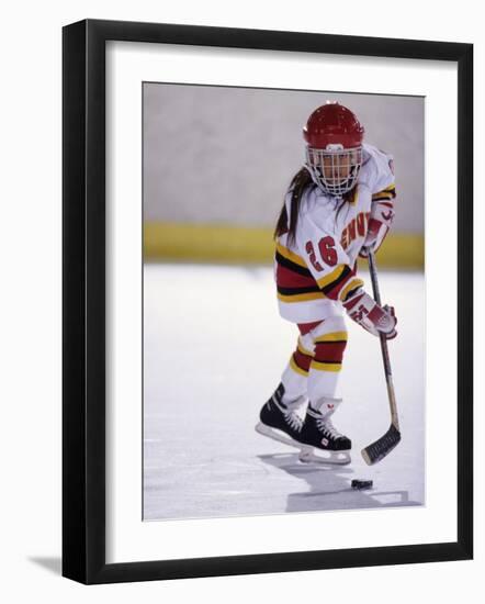 Young Girl Playing Ice Hockey-null-Framed Photographic Print