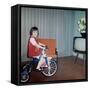 Young Girl Rides Her New Tricycle in the House, Ca. 1967-null-Framed Stretched Canvas