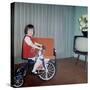 Young Girl Rides Her New Tricycle in the House, Ca. 1967-null-Stretched Canvas