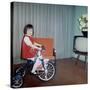 Young Girl Rides Her New Tricycle in the House, Ca. 1967-null-Stretched Canvas