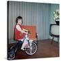 Young Girl Rides Her New Tricycle in the House, Ca. 1967-null-Stretched Canvas