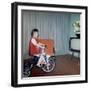 Young Girl Rides Her New Tricycle in the House, Ca. 1967-null-Framed Photographic Print