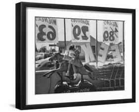 Young Girl Sitting on a Coin Rider Reading a Comic Book at the Supermarket-Dmitri Kessel-Framed Photographic Print