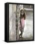 Young Girl Standing Against a Stone Wall-Nora Hernandez-Framed Stretched Canvas