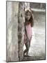 Young Girl Standing Against a Stone Wall-Nora Hernandez-Mounted Giclee Print