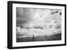 Young Girl Standing in a Field with Clouds-Clive Nolan-Framed Photographic Print