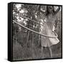 Young Girl Twirling Hula Hoop Outdoors In Sepia For Vintage Look-CherylCasey-Framed Stretched Canvas