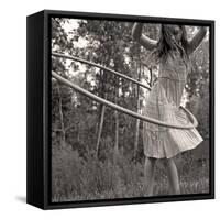 Young Girl Twirling Hula Hoop Outdoors In Sepia For Vintage Look-CherylCasey-Framed Stretched Canvas