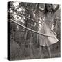 Young Girl Twirling Hula Hoop Outdoors In Sepia For Vintage Look-CherylCasey-Stretched Canvas