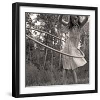 Young Girl Twirling Hula Hoop Outdoors In Sepia For Vintage Look-CherylCasey-Framed Art Print